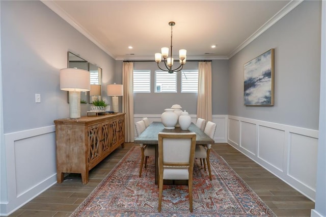 dining space with dark hardwood / wood-style flooring, crown molding, and a notable chandelier