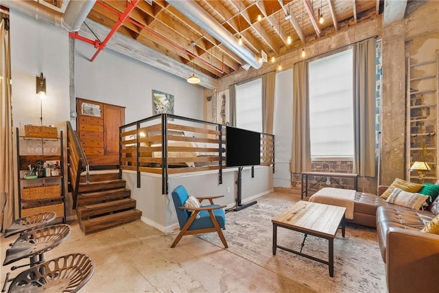 650 Glen Iris Dr NE Unit 26, Atlanta, GA 30308 - living area with stairway and concrete flooring
