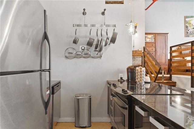 650 Glen Iris Dr NE Unit 26, Atlanta, GA 30308 - kitchen with stainless steel appliances and baseboards