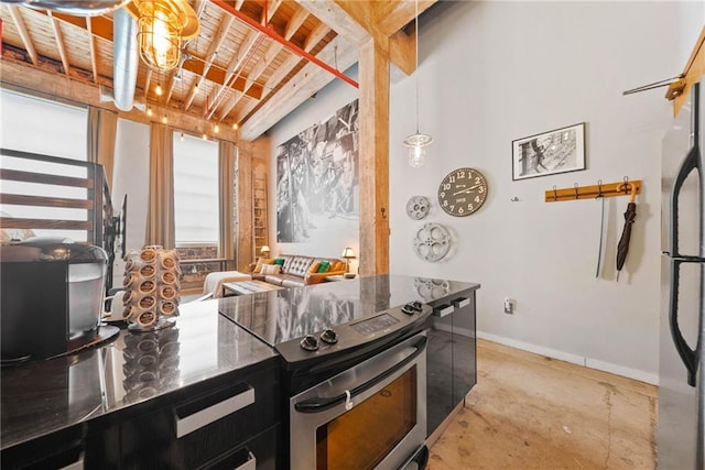 650 Glen Iris Dr NE Unit 26, Atlanta, GA 30308 - kitchen featuring stainless steel electric range, freestanding refrigerator, and concrete floors