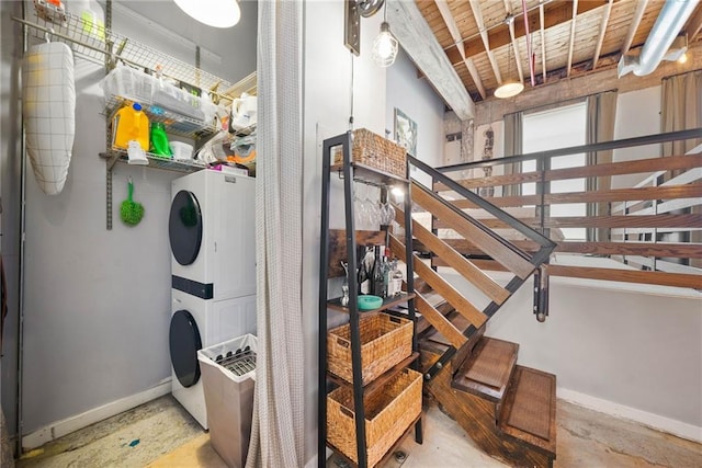 650 Glen Iris Dr NE Unit 26, Atlanta, GA 30308 - stairs featuring stacked washer / dryer and concrete floors