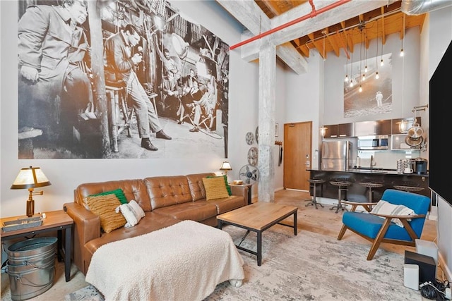 650 Glen Iris Dr NE Unit 26, Atlanta, GA 30308 - living room with a high ceiling and beam ceiling