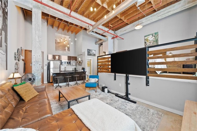 650 Glen Iris Dr NE Unit 26, Atlanta, GA 30308 - living area featuring a high ceiling and concrete floors