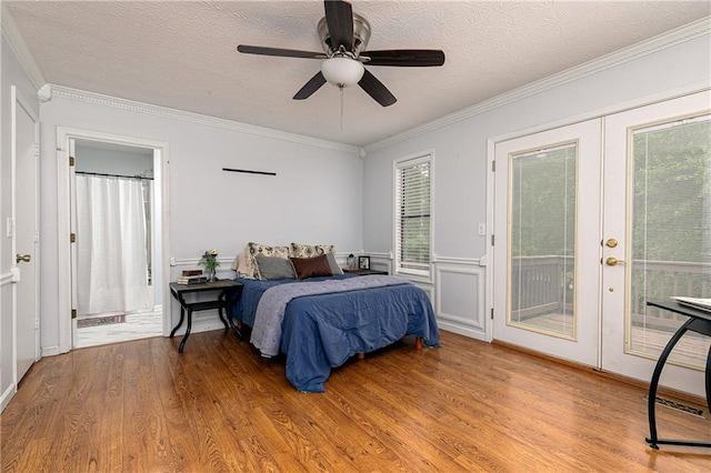 4065 Maxanne Dr NW, Kennesaw, GA 30144 - bedroom featuring french doors, crown molding, light wood-style flooring, a textured ceiling, and access to outside