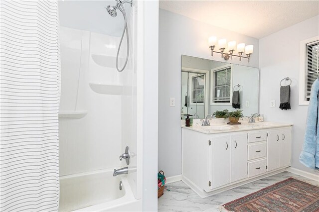 4065 Maxanne Dr NW, Kennesaw, GA 30144 - bathroom with double vanity, marble finish floor, a sink, and washtub / shower combination