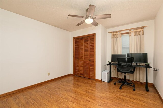 4065 Maxanne Dr NW, Kennesaw, GA 30144 - home office with baseboards, a ceiling fan, wood finished floors, and a textured ceiling