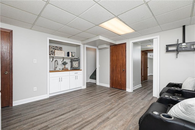 4065 Maxanne Dr NW, Kennesaw, GA 30144 - living room featuring baseboards, wood finished floors, and a drop ceiling