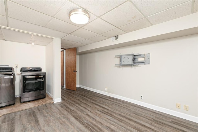 4065 Maxanne Dr NW, Kennesaw, GA 30144 - finished below grade area with washing machine and dryer, baseboards, a paneled ceiling, and wood finished floors