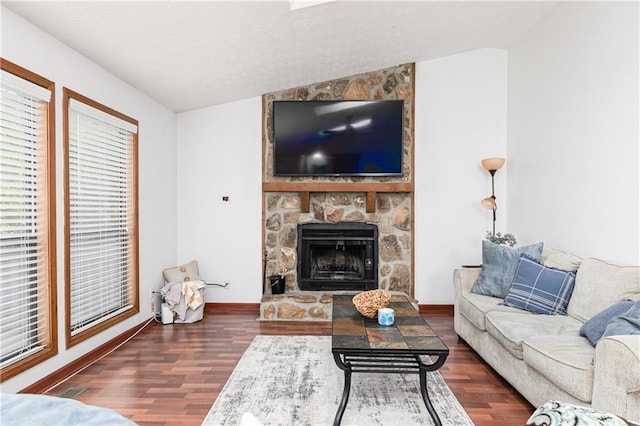 4065 Maxanne Dr NW, Kennesaw, GA 30144 - living area featuring vaulted ceiling, wood finished floors, baseboards, and a stone fireplace