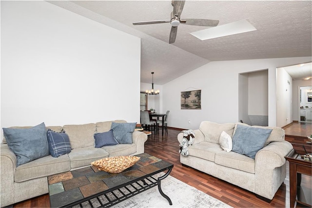 4065 Maxanne Dr NW, Kennesaw, GA 30144 - living area with vaulted ceiling, a textured ceiling, wood finished floors, and ceiling fan with notable chandelier