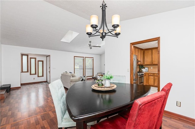 4065 Maxanne Dr NW, Kennesaw, GA 30144 - dining area featuring wood finished floors, a textured ceiling, a skylight, ceiling fan with notable chandelier, and baseboards
