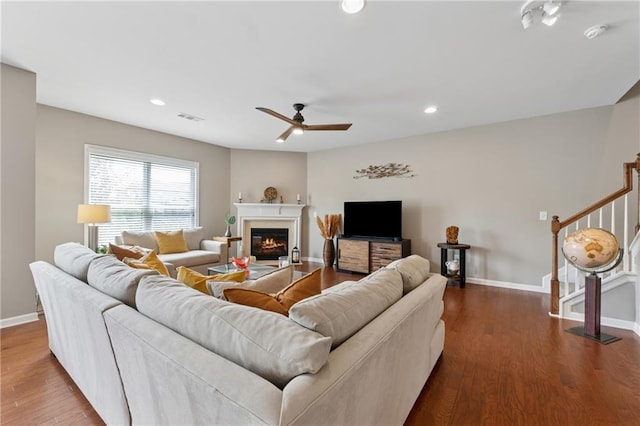 506 Spring View Dr, Woodstock, GA 30188 - living room with stairway, a ceiling fan, wood finished floors, a glass covered fireplace, and recessed lighting