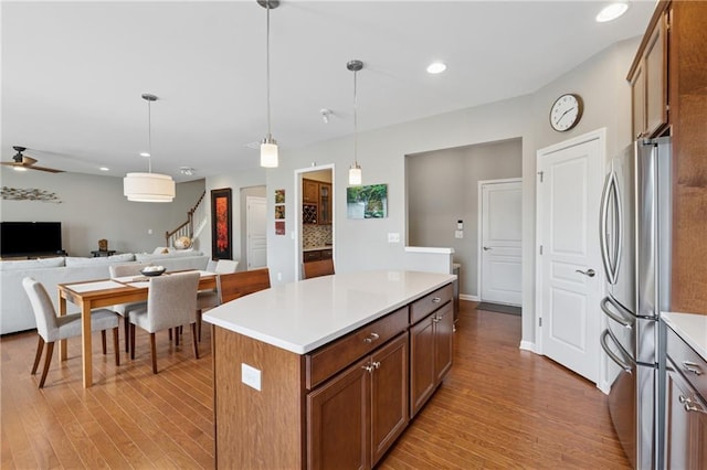 506 Spring View Dr, Woodstock, GA 30188 - kitchen with freestanding refrigerator, light wood-type flooring, open floor plan, light countertops, and recessed lighting