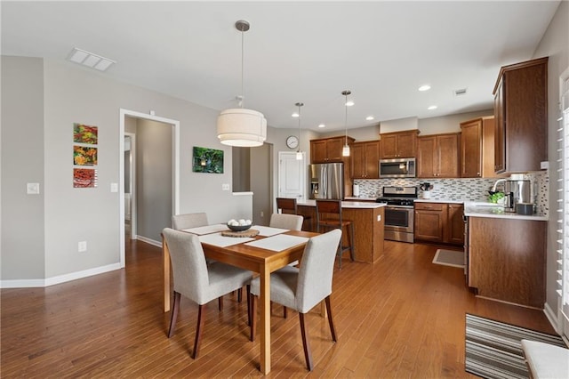 506 Spring View Dr, Woodstock, GA 30188 - dining room with dark wood-style floors and recessed lighting