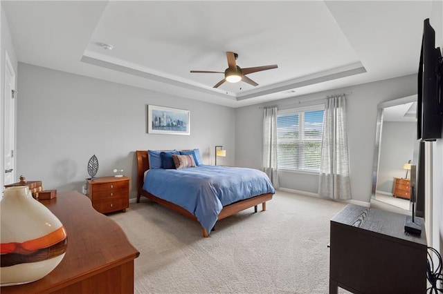 506 Spring View Dr, Woodstock, GA 30188 - bedroom with a tray ceiling, light colored carpet, and ceiling fan