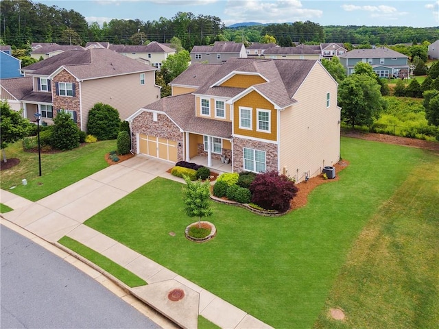 506 Spring View Dr, Woodstock, GA 30188 - craftsman inspired home with stone siding, a residential view, driveway, a front yard, and an attached garage
