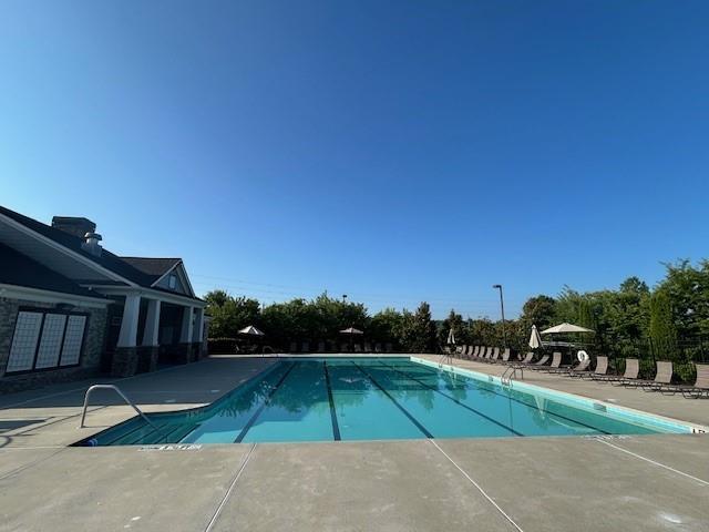 506 Spring View Dr, Woodstock, GA 30188 - community pool featuring a patio area