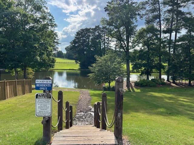 506 Spring View Dr, Woodstock, GA 30188 - view of home's community featuring a water view and a yard