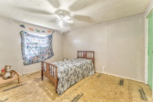 bedroom with ceiling fan and a textured ceiling