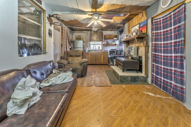 living area with ceiling fan