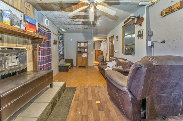 living room with a ceiling fan and wood finished floors