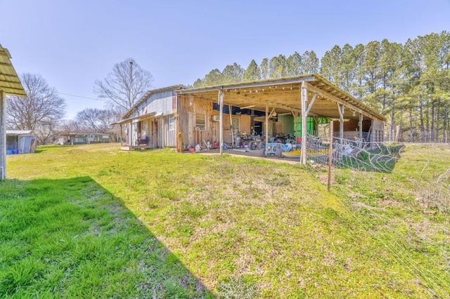 back of property with an outbuilding