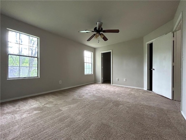 unfurnished bedroom with carpet and ceiling fan