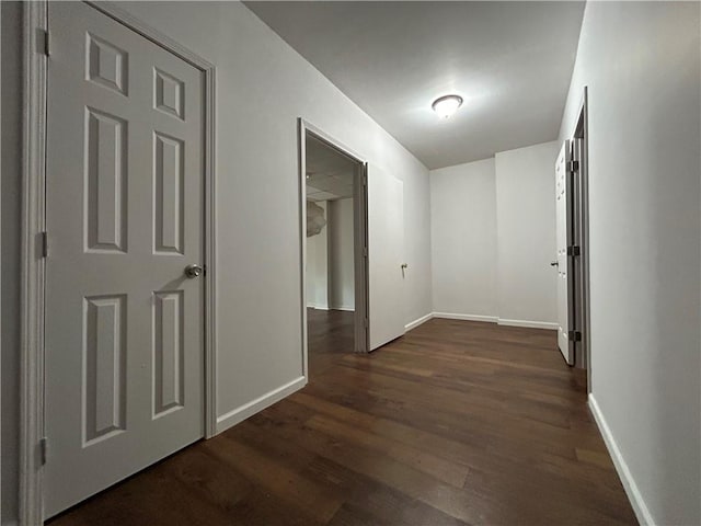 hallway featuring dark hardwood / wood-style floors