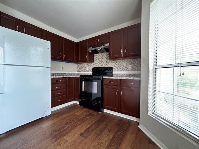 kitchen with decorative backsplash, white refrigerator, dark hardwood / wood-style flooring, and black range with electric cooktop