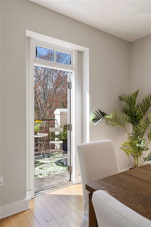 interior space with light wood-style flooring and baseboards