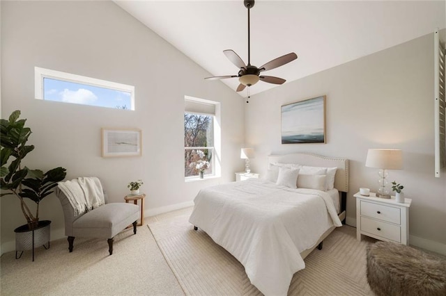 bedroom with baseboards, lofted ceiling, light colored carpet, and ceiling fan