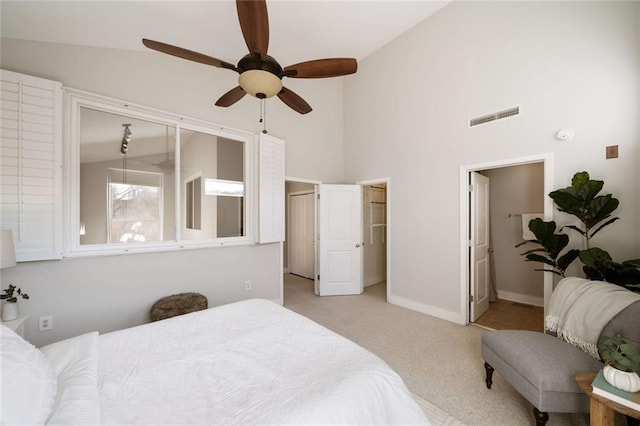 bedroom with a ceiling fan, baseboards, visible vents, high vaulted ceiling, and carpet flooring