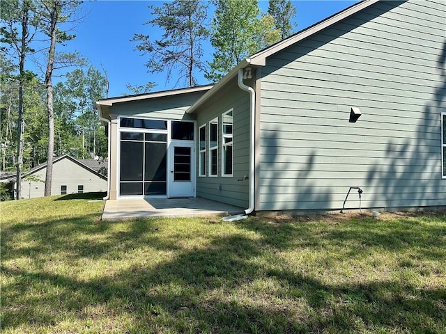 619 Linger Longer Dr, Ellijay, GA 30540 - rear view of house with a lawn, a patio, and a sunroom