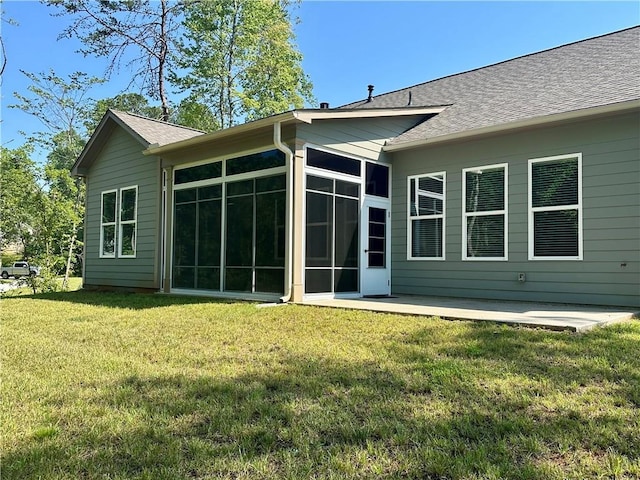619 Linger Longer Dr, Ellijay, GA 30540 - rear view of property featuring a sunroom, a lawn, a shingled roof, and a patio