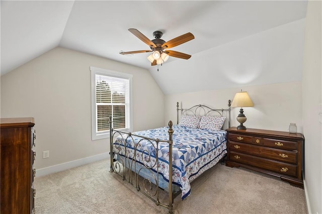 bedroom featuring light carpet, ceiling fan, vaulted ceiling, and baseboards