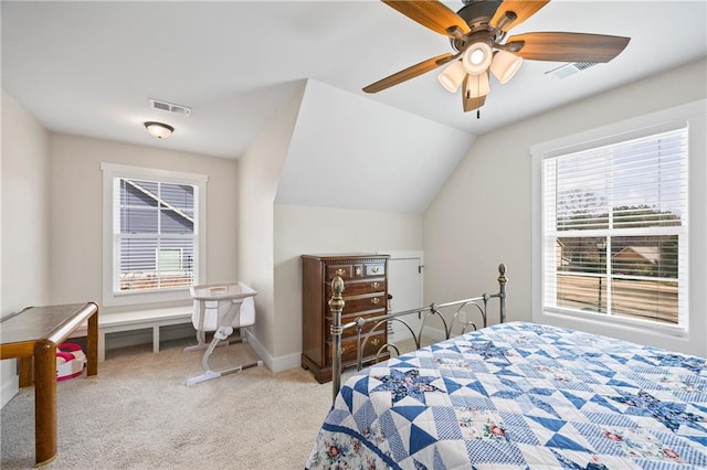 bedroom with carpet floors, baseboards, visible vents, and lofted ceiling