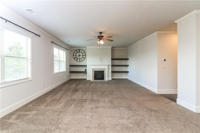 626 Discovery Ct, Acworth, GA 30102 - unfurnished living room featuring a fireplace with flush hearth, crown molding, a ceiling fan, and carpet flooring