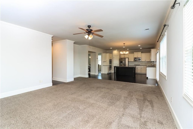 626 Discovery Ct, Acworth, GA 30102 - unfurnished living room with dark carpet, recessed lighting, baseboards, and ceiling fan with notable chandelier