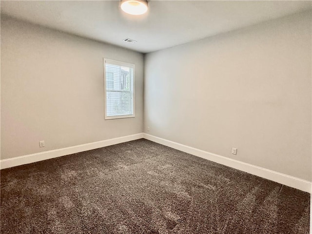 626 Discovery Ct, Acworth, GA 30102 - empty room featuring baseboards, dark colored carpet, and visible vents