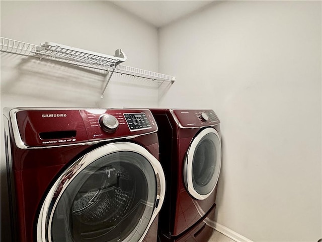 626 Discovery Ct, Acworth, GA 30102 - clothes washing area featuring laundry area, baseboards, and washing machine and clothes dryer