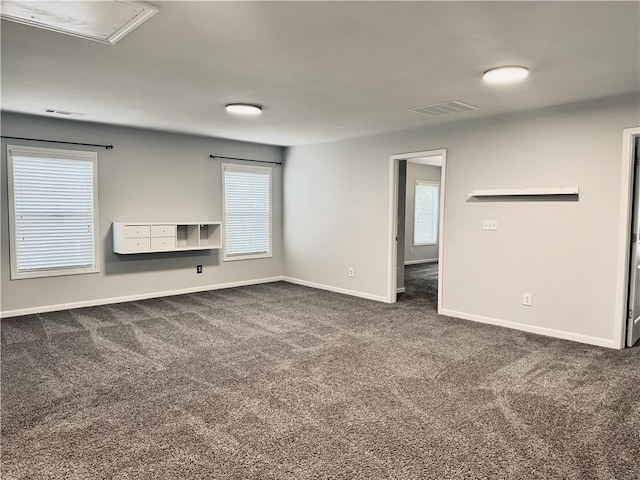 626 Discovery Ct, Acworth, GA 30102 - empty room featuring baseboards, attic access, dark carpet, and visible vents