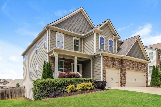 626 Discovery Ct, Acworth, GA 30102 - craftsman-style house featuring a front yard, fence, driveway, and stone siding