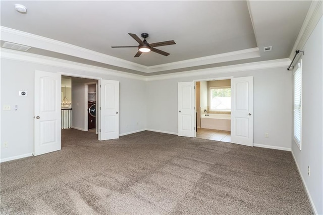 626 Discovery Ct, Acworth, GA 30102 - unfurnished room featuring a tray ceiling, baseboards, ceiling fan, and carpet flooring