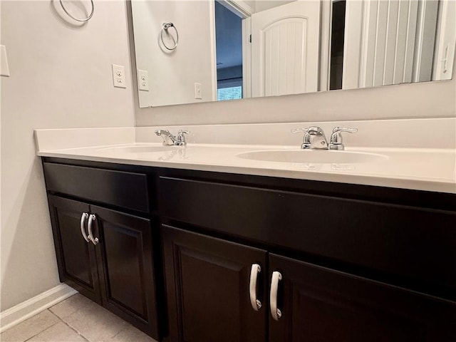626 Discovery Ct, Acworth, GA 30102 - bathroom with a sink, tile patterned floors, baseboards, and double vanity
