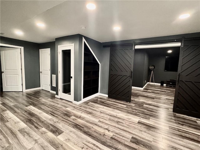 626 Discovery Ct, Acworth, GA 30102 - bonus room featuring baseboards, a barn door, wood finished floors, and recessed lighting