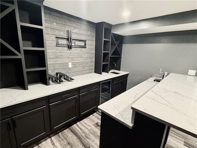 626 Discovery Ct, Acworth, GA 30102 - bar with wine cooler and light wood-style floors