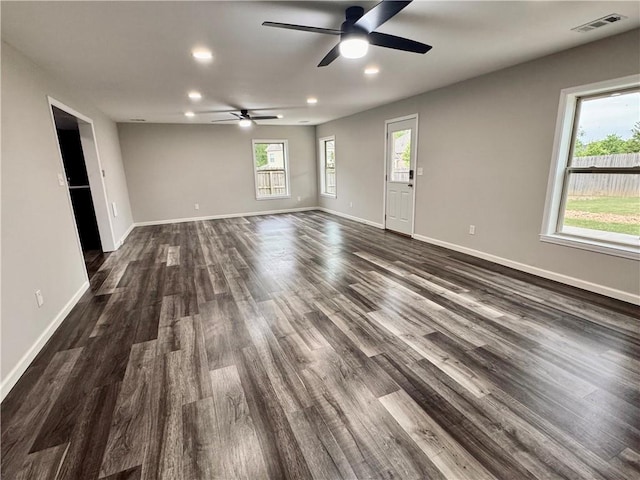 626 Discovery Ct, Acworth, GA 30102 - unfurnished living room featuring dark wood-style flooring, a ceiling fan, baseboards, recessed lighting, and visible vents