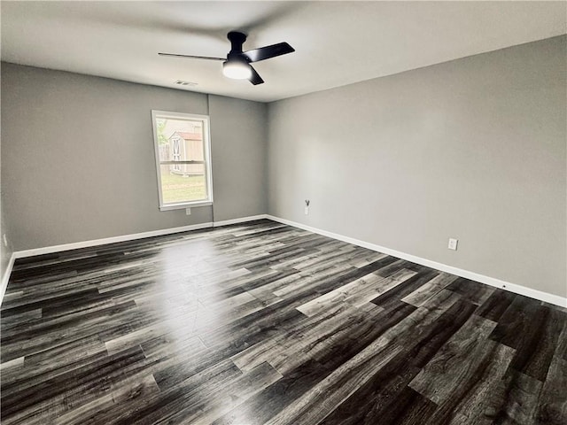 626 Discovery Ct, Acworth, GA 30102 - empty room with a ceiling fan, baseboards, dark wood finished floors, and visible vents