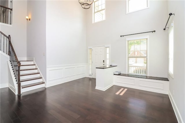 626 Discovery Ct, Acworth, GA 30102 - foyer with dark wood finished floors, a high ceiling, a notable chandelier, and stairway