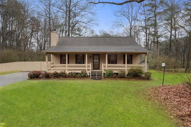 view of front of home featuring a front yard and a porch